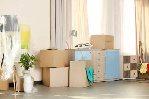 Mover navigating stairs and access challenges in a Kentishtown property