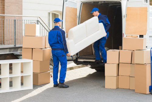 Preparing boxes and furniture for a moving truck in Kentishtown