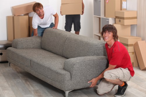 Professional movers loading household items for removal services in Kentishtown