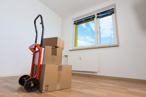 Local moving van navigating Kentishtown streets with household items