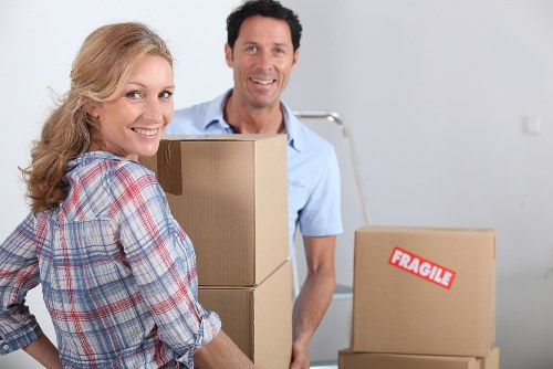 Packed office items and labelled boxes for business relocation